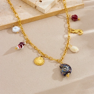 Gold stainless steel ocean charm necklace with colorful shell and seahorse pendants