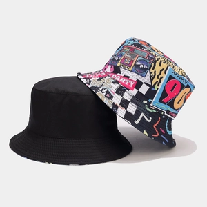 Close-up of retro 90s graffiti bucket hat and classic black reversible sun cap