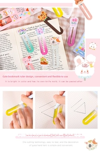 Macro detail of cute cartoon animal ruler bookmarks featuring creative tiger and pig designs