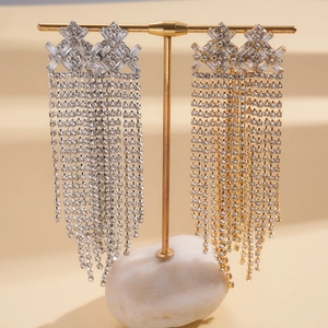 Luxurious geometric tassel earrings with brilliant zircons in silver and gold finishes