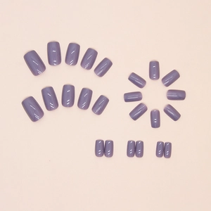 Glossy light purple square press-on nails set displayed on a soft pink background