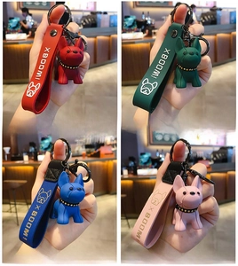 French Bulldog keychains in red, green, blue, and pink colors with silicone wrist straps