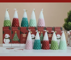 Christmas tree scented candles with mini bells and decorative Merry Christmas gift boxes