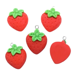 Five red resin strawberry pendants for DIY jewelry making on white background