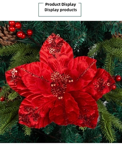 Macro shot of red velvet Christmas poinsettia with glitter sequins and holiday pine decor