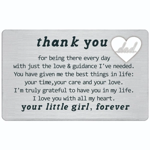 Macro view of brushed stainless steel wallet insert card with engraved message for dad