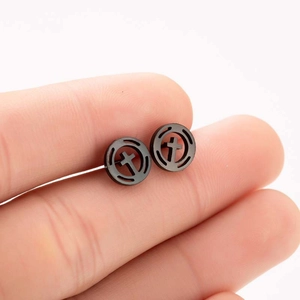 Minimalist black stainless steel round ear studs with hollow cross design on earlobe