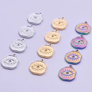 Set of stainless steel evil eye charms in silver, gold, and rainbow finishes for jewelry