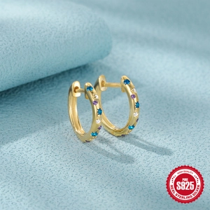 S925 sterling silver gold huggie earrings with multicolor inlaid gemstones on blue surface