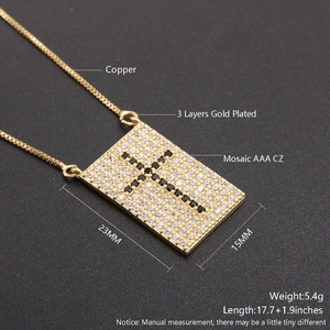 Detail of cross pendant with measurements showing 23mm by 15mm dimensions and AAA zirconia