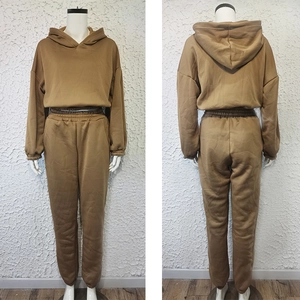 Front and back view of brown hooded sweatshirt and drawstring jogger pants on mannequin