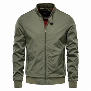 Detail of army green bomber jacket featuring a red lining, stand collar, and metal zipper