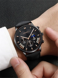 Close-up of Geneva men's chronograph watch with black leather strap and gold markers