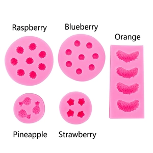 Pink silicone fruit molds set for fondant including strawberry and blueberry shapes