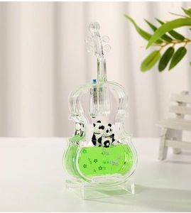 Detail of panda liquid hourglass ornament in violin shape with green floating oil