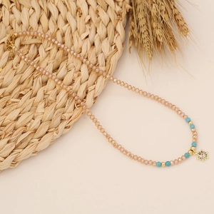 Bohemian star heart necklace with crystal pendant on natural woven background