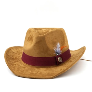 Western cowboy felt hat in camel with ethnic feather ribbon and vintage metal button