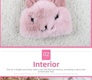 Detail of pink faux fur plush glove showing soft texture and cute rabbit character design