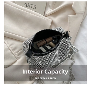 Silver rhinestone pillow bag interior view with lipstick and compact inside the handbag