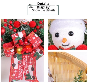 Detail view of snowman doll, red berry accents, and Merry Christmas bow on bamboo wreath