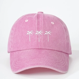 Pink washed denim baseball cap featuring three white embroidered coconut trees
