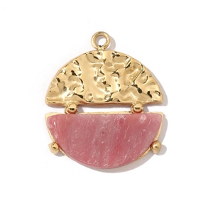 Detail view of a hammered gold metal and pink stone pendant charm for jewelry making