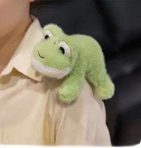Cute green plush frog plushie accessory worn on shoulder with soft textured fur