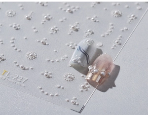 Macro shot of 3D pearl nail art stickers TL-227 featuring white embossed geometric lines
