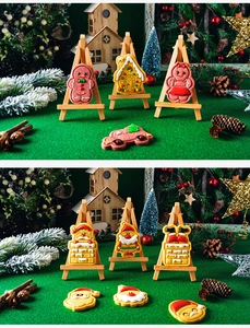 Detailed view of Christmas 3D cookies like gingerbread man on festive wooden stands