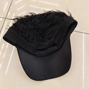 Top-down view of black funny baseball cap featuring synthetic wig hair and cotton fabric