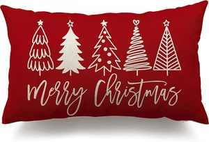 Detailed macro view of red linen Christmas pillowcase with white festive tree prints