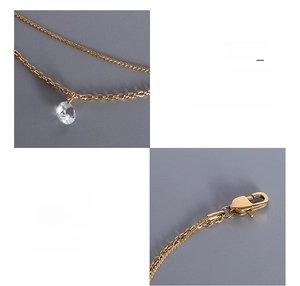 Macro detail of 18K gold-plated double-layer bracelet with sparkling zircon stone