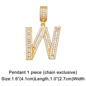 Macro detail of iced-out letter W pendant with gold plating and cubic zirconia stones