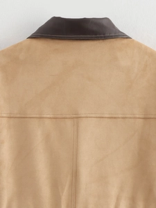 Close-up of the back seam and two-tone suede contrast stitching on a long warm jacket