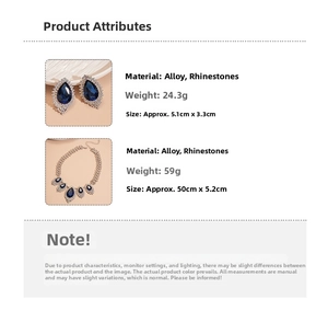 Detailed view of vintage diamond drop necklace and earrings set with blue rhinestones