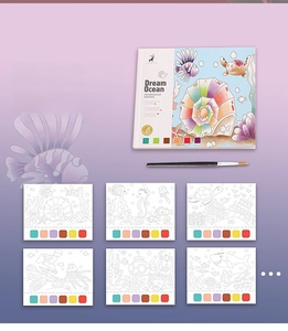 Detailed inner page view of Dream Ocean watercolor book with built-in paint palettes