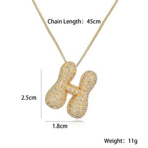 Detail view of gold letter H pendant necklace with dimensions 2.5x1.8cm and 45cm chain