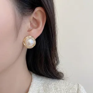 Vintage large pearl stud earrings with gold spiral texture for women fashion and elegance