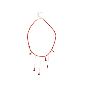 Beaded red fringe necklace with golden chain and bohemian tassel pendant on white background