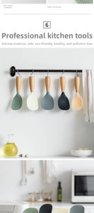 Macro detail of silicone rice spoon with non-stick textured head and natural wooden handle
