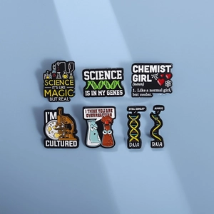 Set of 7 science enamel pins featuring DNA and microscopes on a light blue background