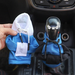 Detail of mini hoodie car gear shift covers in blue-white and blue-black knit fabric