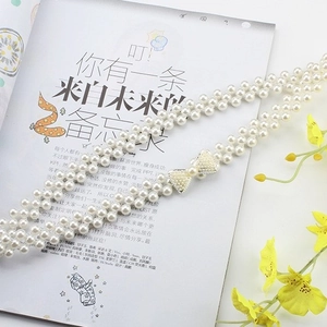 Three-row stretch pearl belt for dresses with a sparkling rhinestone bow buckle
