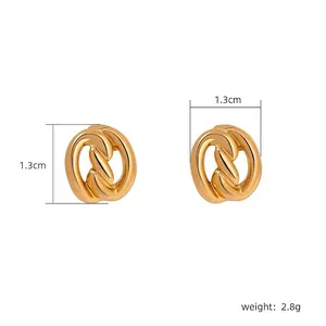 Detailed view of minimalist gold plated knot earrings measuring 1.3cm and weighing 2.8g