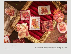 Detail of vintage Wish Bear stickers with musical teddy bears on a red velvet jewelry tray
