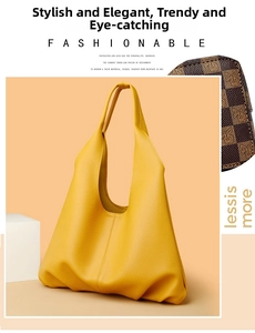 Close-up of bright yellow tote bag showing premium pebbled leather texture and hobo design