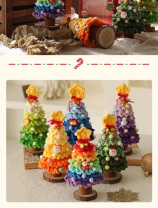 Detail of handcrafted crochet mini Christmas trees with colorful pom-poms and wooden base