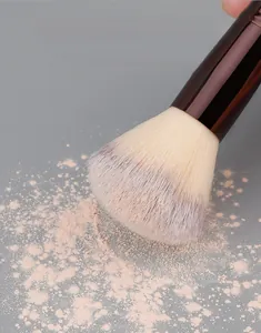 Macro detail of dense synthetic bristles holding powder for flawless face makeup