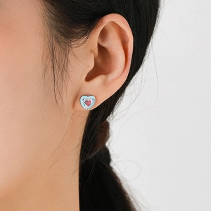 S925 sterling silver heart earrings with pink zircon on model for daily style