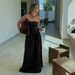 Elegant strapless high-waisted black maxi dress with a flowing A-line silhouette